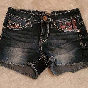 Justice Jean short with coral and and white